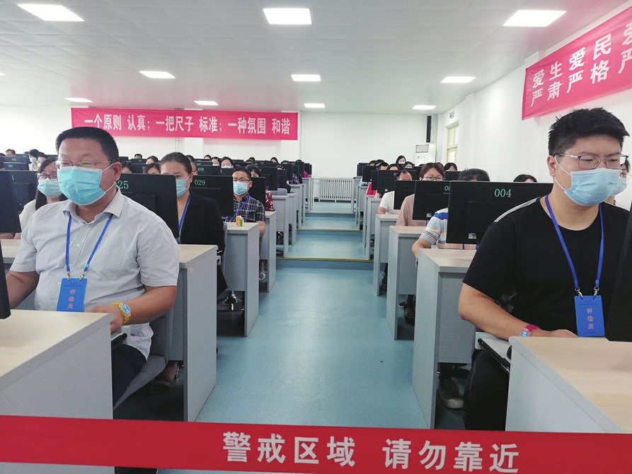 一张中考试卷的“阅卷之旅”:正评前先“热身”主观题均“双评”